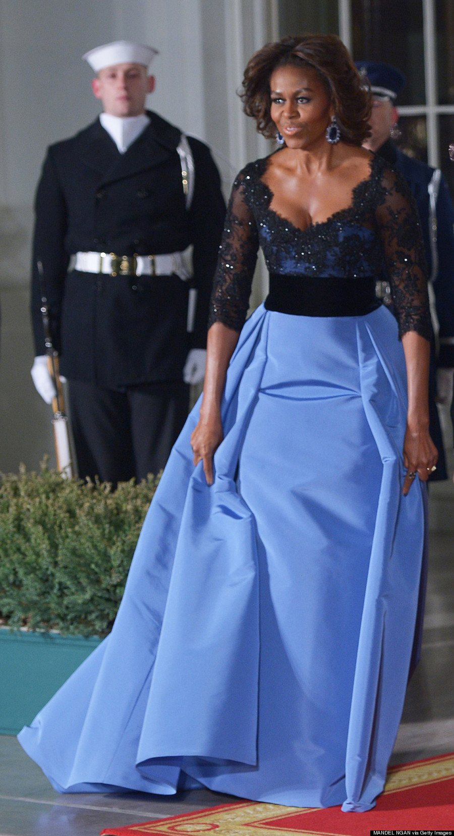 US President Barack Obama, First Lady Michelle Obama pose with French President Francois Hollande as he arrives for the State Dinner at the North Portico of the White House on February 11, 2014 in Washington, DC. AFP PHOTO/Mandel NGAN        (Photo credit should read MANDEL NGAN/AFP/Getty Images)